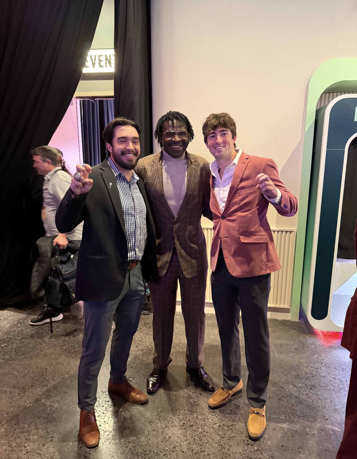 Michael Irvin of the Dallas Cowboys Poses with TCU Football Players Franklin Estrada, Keagan Cunningham